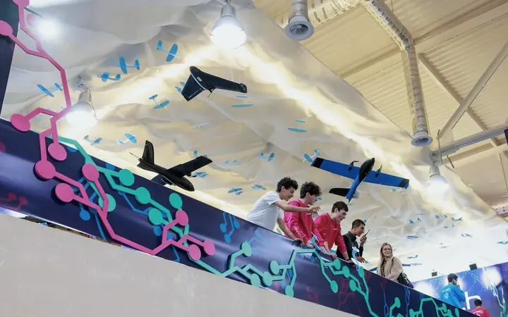 Drones built by Armathians hanging over the DigiTec stand